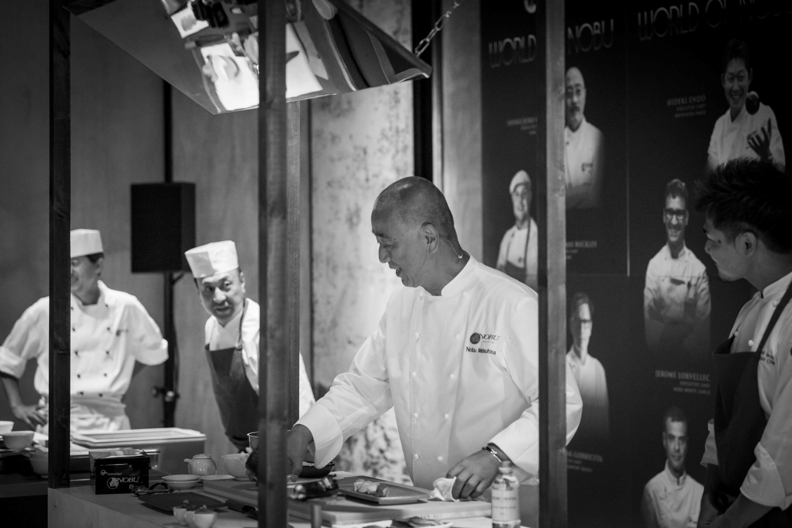 Black and white image of Nobu chef and staff members preparing meals