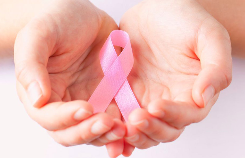 Breast Cancer Pink Ribbon in Hands